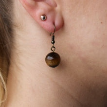 Load image into Gallery viewer, Brown Tiger&#39;s Eye orb earrings with silver hooks.