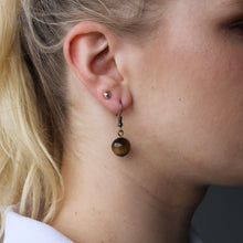 Load image into Gallery viewer, Brown Tiger&#39;s Eye orb earrings with silver hooks.