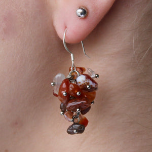 Carnelian earrings with red, orange, and brown stones and genuine silver hooks.