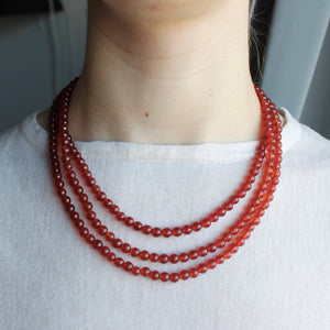 Orange-brown Carnelian triple layer orb necklace.