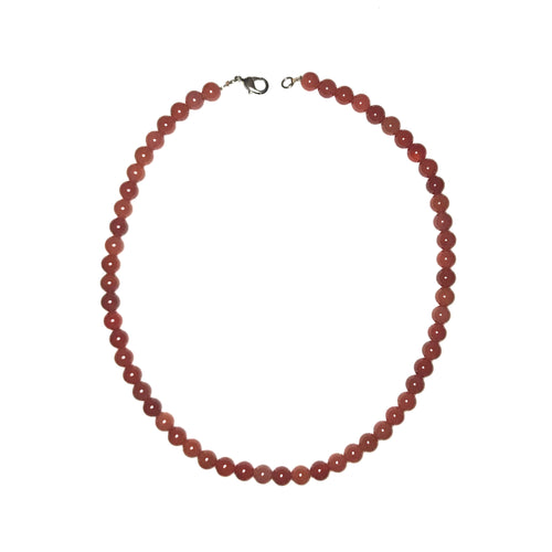 Orange-brown Carnelian orb necklace.