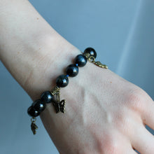 Load image into Gallery viewer, Falcon&#39;s Eye stone bracelet with gold charms and clasp