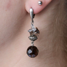 Load image into Gallery viewer, Purple Topaz orb dangling earrings with silver ornament and clasps.