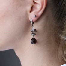 Load image into Gallery viewer, Purple Topaz orb dangling earrings with silver ornament and clasps.