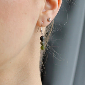 Jade triple stone orb dangling earrings with silver hooks.