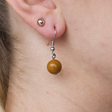 Load image into Gallery viewer, Yellow-brown orb Jasper stone earrings with silver hooks.