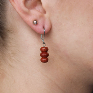 Three brownish-red Jasper stones on silver clasp dangle earrings.