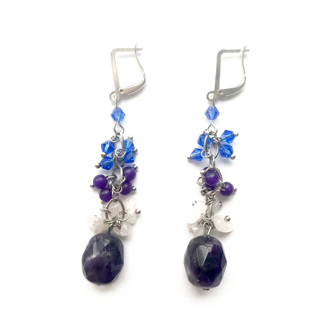 Purple Amethyst dangling earrings with silver hooks.